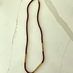 Artisan-made rope necklace with brass hardware